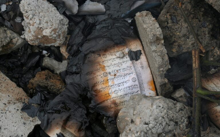 The burned-out pages of the Holy Quran are in Izbat Abed Rabo Mosque. — Wikimedia Commons