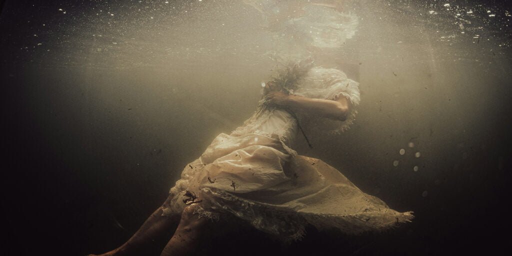 A drowning woman in clothes.